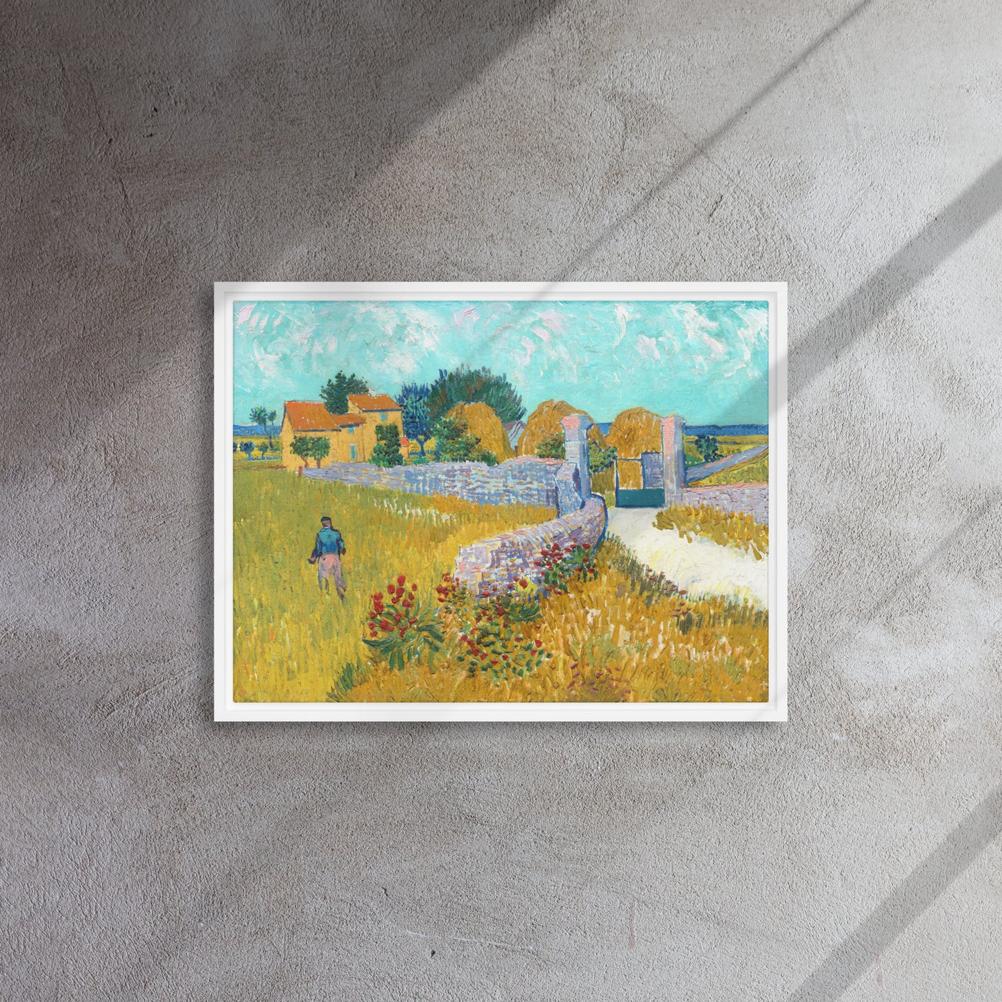 Van Gogh's 'Farmhouse in Provence' on a 18"x24" white framed canvas print on a textured gray wall.