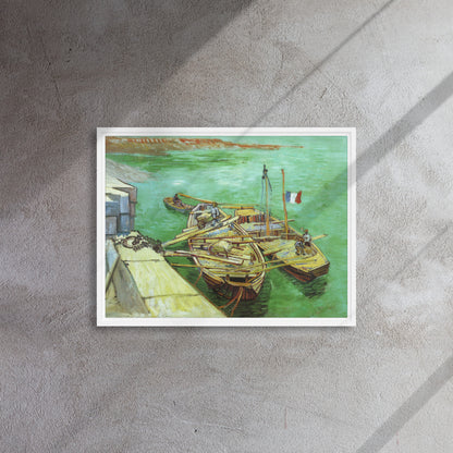Van Gogh's 'Quay with Men Unloading Sand Barges' on a 18"x24" white framed canvas print on a textured gray wall.