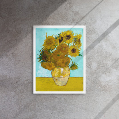 Van Gogh's 'Vase with Twelve Sunflowers' on a 18"x24" white framed canvas print on a textured wall.