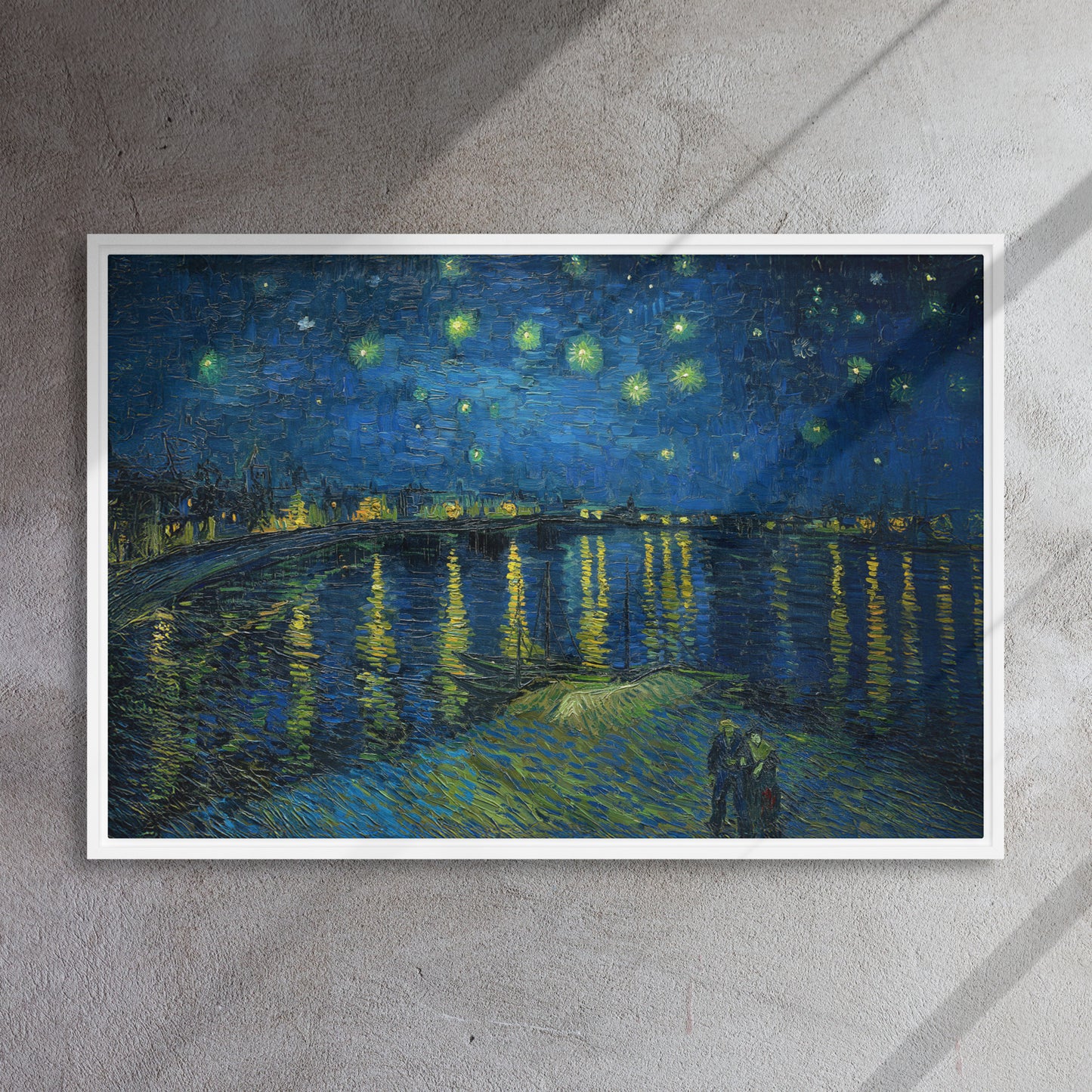 Van Gogh's 'Starry Night Over the Rhone' on a 24"x36" white framed canvas print on a textured gray wall.