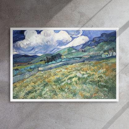 Van Gogh's 'Landscape from Saint-Rémy' on a 24"x36" white framed canvas print on a textured gray wall.