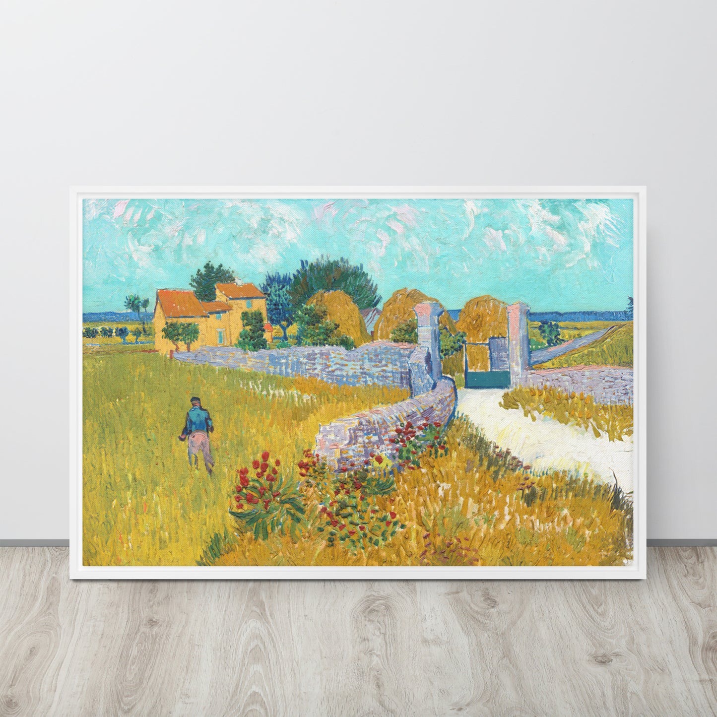 Van Gogh's 'Farmhouse in Provence' on a 24"x36" white framed canvas print sitting on a wooden floor leaning against a light gray wall.