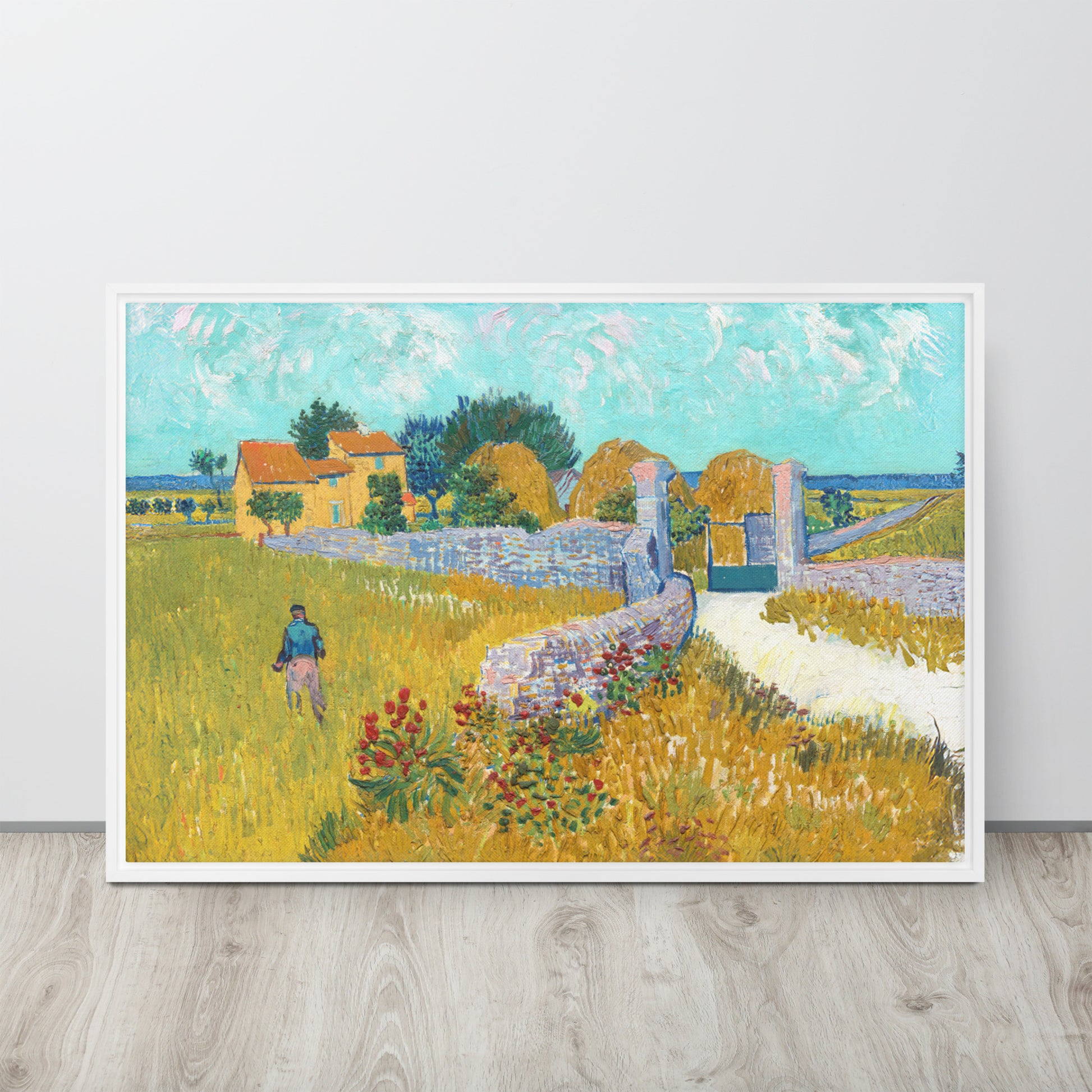 Van Gogh's 'Farmhouse in Provence' on a 24"x36" white framed canvas print sitting on a wooden floor leaning against a light gray wall.