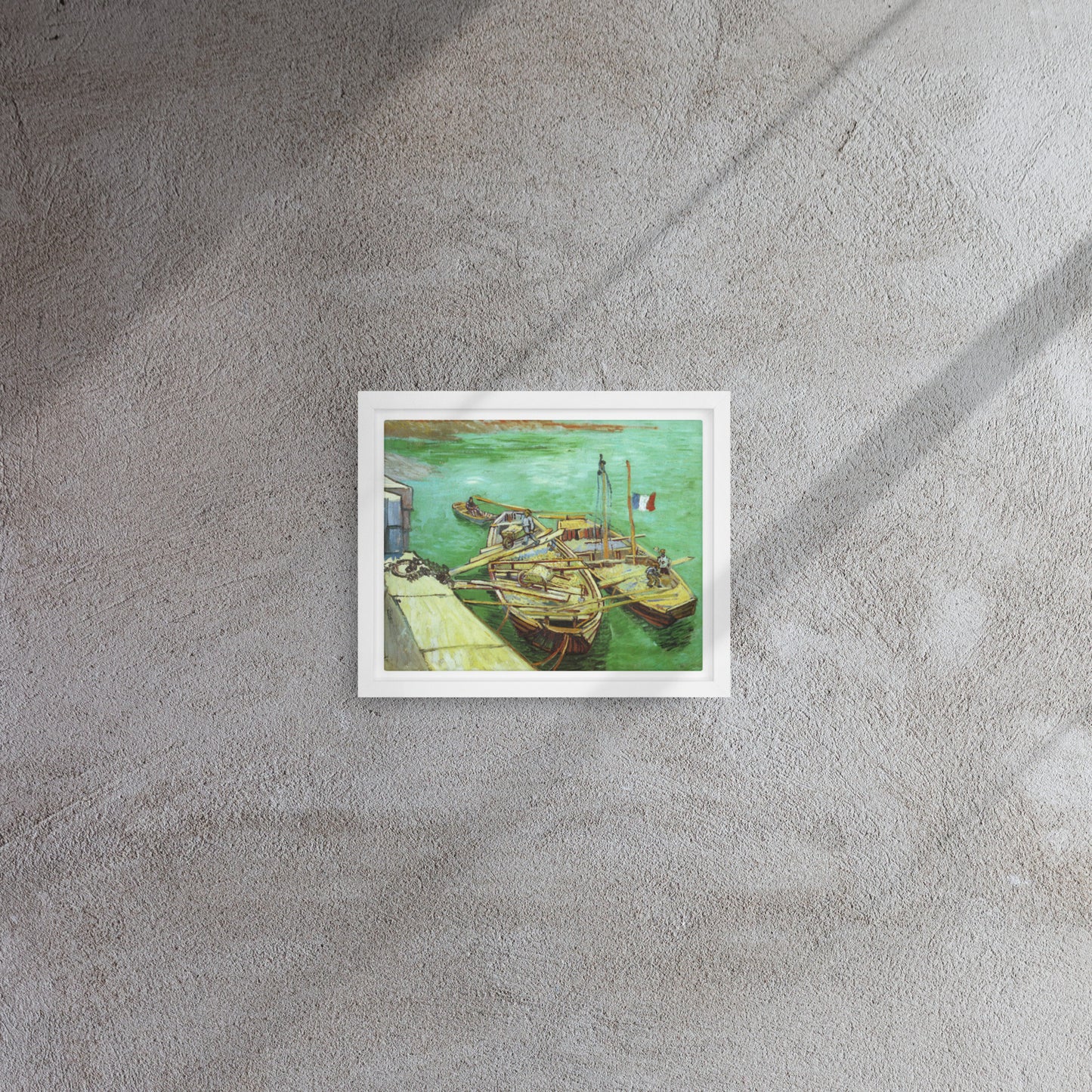 Van Gogh's 'Quay with Men Unloading Sand Barges' on a 8"x10" white framed canvas print on a textured gray wall.