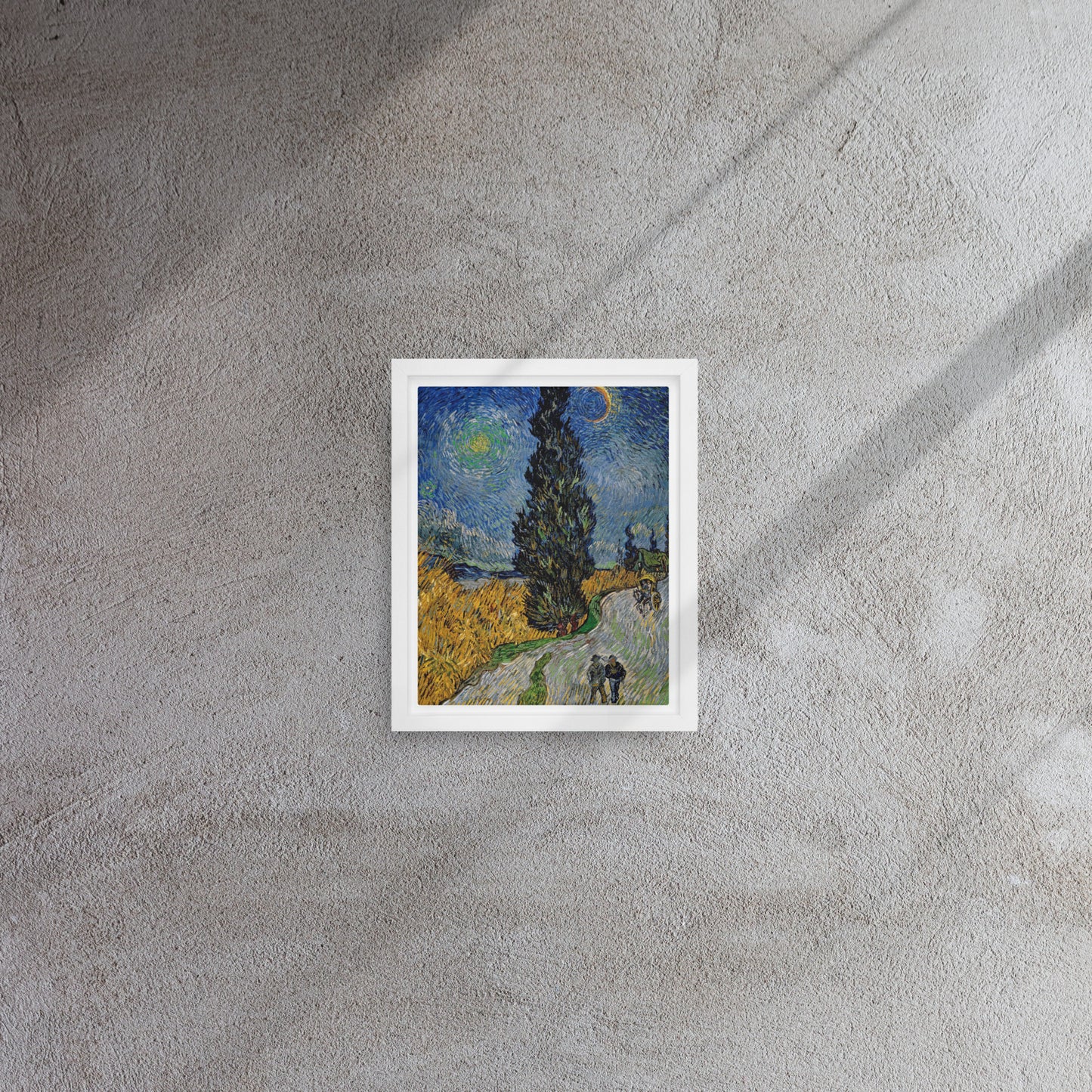 Van Gogh's 'Road with Cypress and Star' on a 8"x10" white framed canvas print on a textured gray wall.