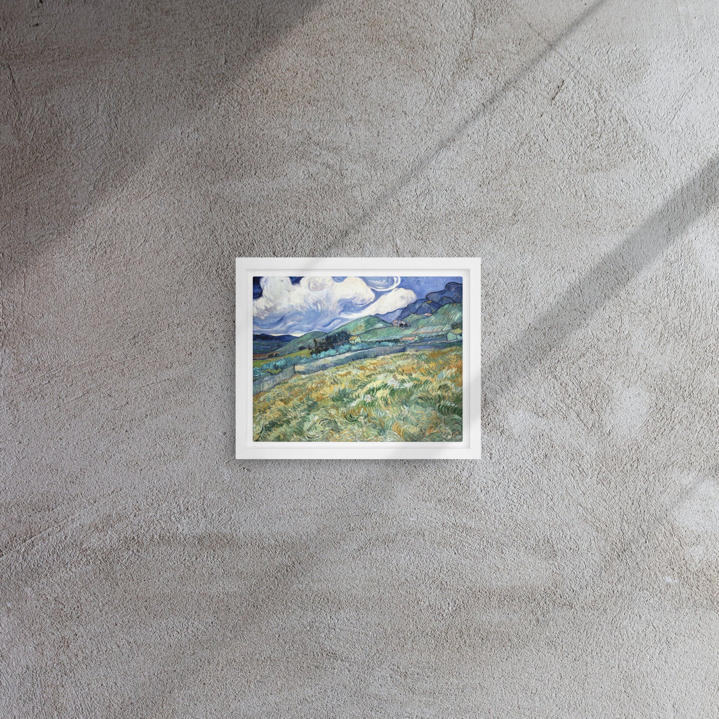 Van Gogh's 'Landscape from Saint-Rémy' on a 8"x10" white framed canvas print on a textured gray wall.